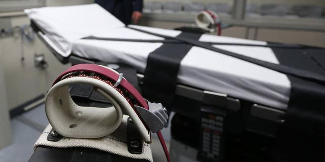File - This Oct. 9, 2014 file photo, shows an arm restraint on the gurney in the the execution chamber at the Oklahoma State Penitentiary in McAlester, Okla. Attorneys for 21 death row inmates who will be in a federal court this week challenging Oklahoma's lethal injection procedure outlined their strategy in court documents that reveal grisly new details in the botched execution of an inmate in April, 2014. (AP Photo/Sue Ogrocki, File)