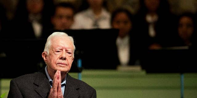 FILE - In a Sunday, Aug. 23, 2015 file photo, former President Jimmy Carter teaches Sunday School class at Maranatha Baptist Church in his hometown, in Plains, Ga. Former President Carter said Sunday, Dec. 6, 2015, that no cancer was detected in his latest scan. (AP Photo/David Goldman, File)