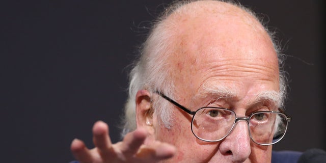 Oct. 11, 2013: Britain's Professor Peter Higgs gestures during a press conference in Edinburgh, Scotland in this file photo.
