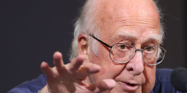 Oct. 11, 2013: Britain's Professor Peter Higgs gestures during a press conference in Edinburgh, Scotland in this file photo.