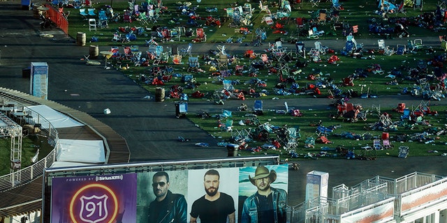 In this Oct. 3, 2017, file photo, personal belongings and debris litters the Route 91 Harvest festival grounds across the street from the Mandalay Bay resort and casino in Las Vegas.