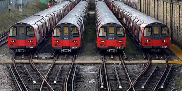 FILE - In this Monday, Dec. 26, 2011 file photo, Underground trains are parked during a 24-hour strike by train drivers over public holiday pay, at Mordern depot, south London. Millions of commuters face travel woes as workers at London’s underground transport network, the Tube, prepare to go on strike. A walkout is scheduled to start later Tuesday, Feb. 4, 2104,  through to Thursday, and a second one is due Feb 11-13. (AP Photo/Sang Tan, File)