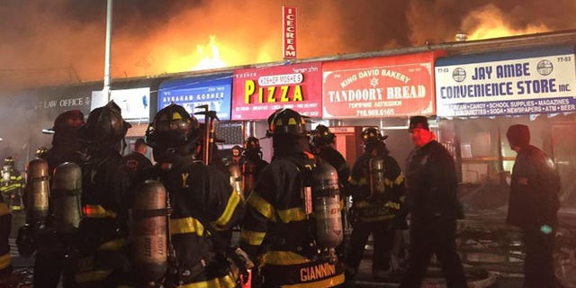 New York City firefighters at the scene of a fire in Kew Gardens Hills Friday. (FDNY)