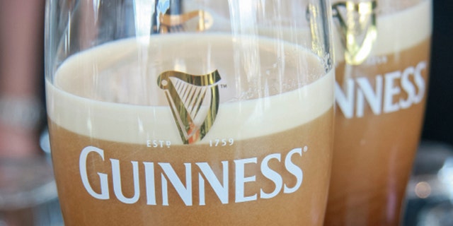 Dublin, Ireland - June 19, 2008: Two pints of beer served at The Guinness Brewery, founded by Arthur Guinness in 1759, where 2.5 million pints of stout are brewed daily