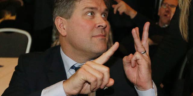 FILE - A Saturday, Oct. 29, 2016 file photo of Bjarni Benediktsson of The Independence Party gesturing after the first results of the election in Reykjavik, Iceland. Iceland has a new center-right government almost three months after an election that produced no outright winner. The Independence Party, which won the largest share of seats, has formed a coalition with the smaller Reform and Bright Future parties. State broadcaster RUV says Independence Party leader Bjarni Benediktsson will become prime minister. (AP Photo/Frank Augstein, File)