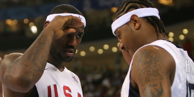 BEIJING - AUGUST 20: Lebron James #6 and Carmelo Anthony #15 of the United States salute one another before the men's basketball quarterfinal game against Australia at the Olympic Basketball Gymnasium during Day 12 of the Beijing 2008 Olympic Games on August 20, 2008 in Beijing, China. (Photo by Streeter Lecka/Getty Images)