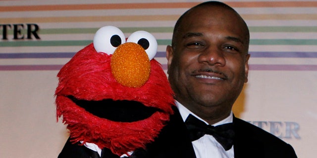 Kevin Clash (right) and Elmo.