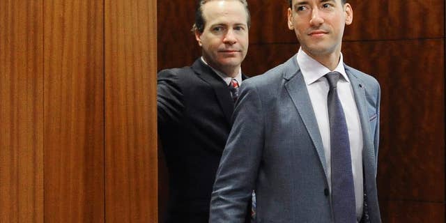 David Daleiden, right, leaves a courtroom after a hearing in Houston, April 29, 2016.