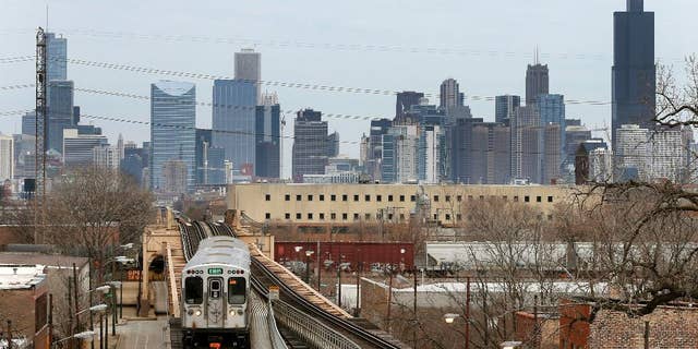 A Chicago Transit Authority Green Line train travels West away from downtown Chicago, Thursday, March 23, 2017, in Chicago. Census data shows the Chicago region has lost more residents than any other U.S. metropolitan area, a drop that comes as other Midwestern cities lost population and South and Southwest parts of the country saw gains. (AP Photo/Charles Rex Arbogast)