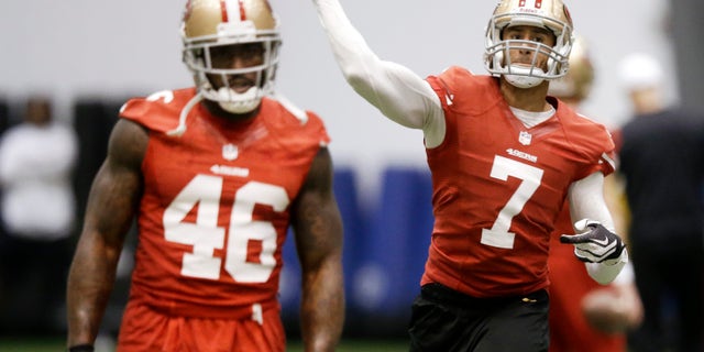 San Francisco 49ers quarterback Colin Kaepernick (7) passes as tight end Delanie Walker (46) waits to run a route during practice on Wednesday, Jan. 30, 2013, in New Orleans. The 49ers are scheduled to play the Baltimore Ravens in the NFL Super Bowl XLVII football game on Feb. 3. (AP Photo/Mark Humphrey)