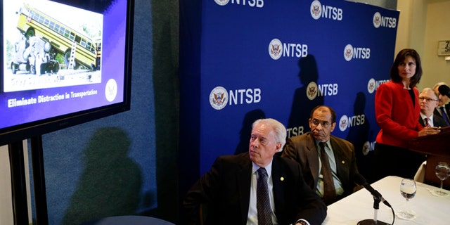 National Transportation Safety Board (NTSB) Chair Deborah Hersman, third from right, along with board members, from left: Earl F. Weener; Christopher A. Hart; Robert L. Sumwalt; and Mark R. Rosekind watch a video a news conference regarding its 2013 "Most Wanted List" of transportation challenges, Wednesday, Nov. 14, 2012, during a news conference at the National Press Club in Washington. (AP Photo/Charles Dharapak)
