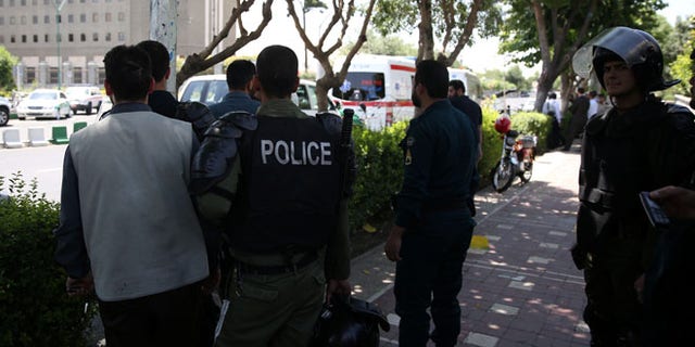 Iranian police stand near the parliament's building during a gunmen attack in central Tehran, Iran, June 7, 2017. TIMA via REUTERS ATTENTION EDITORS - THIS IMAGE WAS PROVIDED BY A THIRD PARTY. FOR EDITORIAL USE ONLY. - RTX39DS2