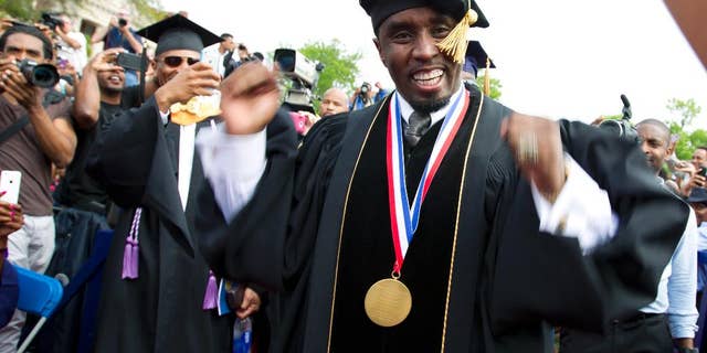 FILE - In this May 10, 2014, file photo, entertainer and entrepreneur Sean "Puff Daddy" Combs arrives to the 2014 Howard University graduation ceremony at Howard University in Washington. Combs announced a $1 million donation to the school on Sept. 23, 2016, during his concert in Washington. (AP Photo/Jose Luis Magana, File)