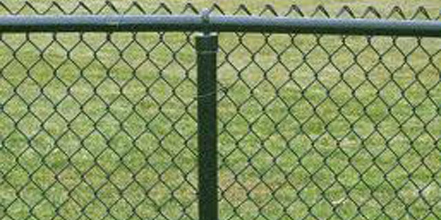 A chain link fence separates the backyards of Chris Smith and the registered sex offender who propositioned his 10-year-old daughter.