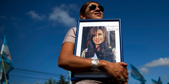 Jan. 4, 2012: Rosa Calderon holds a picture of Argentina's President Cristina Fernandez that reads in Spanish "Be strong Cristina" outside the hospital where Fernandez will undergo surgery for thyroid cancer in Pilar, Argentina. The 58-year-old leader has papillary thyroid carcinoma, and her doctors said it was detected before it spread, so her condition should curable without chemotherapy. Vice President Amado Boudou will be in charge during the operation on Wednesday and for 20 days as she recovers.
