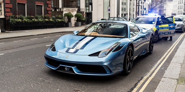 The Ferrari was pulled over for blocking the road, then its driver got the really bad news.
