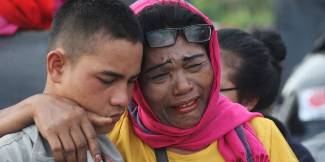 Relatives of the victims wait for news on any survivors.