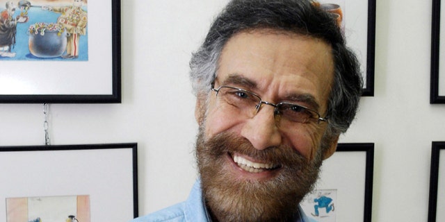 August 14: Syrian cartoonist Ali Farzat poses in his atelier in Damascus, Syria. Syrian security forces attacked renowned anti-regime cartoonist Ali Farzat early Thursday in Damascus and left him bleeding along the side of a road, human rights activists said.