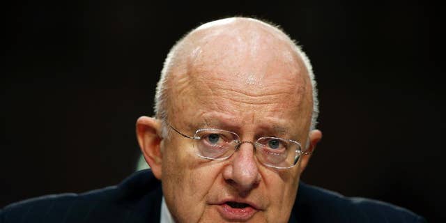 Obama administration Director of the National Intelligence James Clapper told a reporter to take the "kill shot" on Michael Flynn, newly revealed text messages show. (AP Photo/Alex Brandon, File)