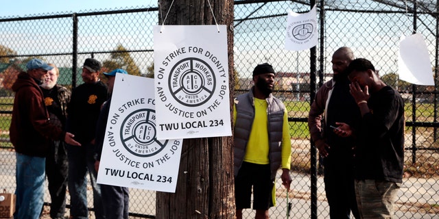 Signs hang on a telephone pole as workers picket across from the Callowhill SEPTA Depot Tuesday, Nov. 1, 2016, in Philadelphia.
