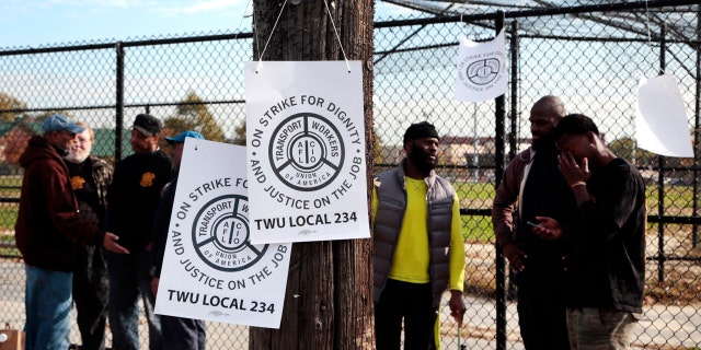 Signs hang on a telephone pole as workers picket across from the Callowhill SEPTA Depot Tuesday, Nov. 1, 2016, in Philadelphia.