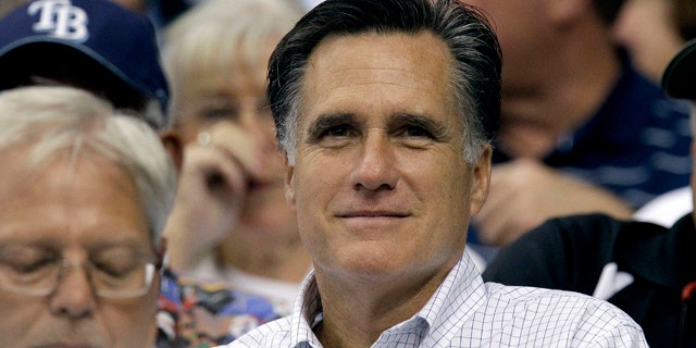 June 15: GOP hopeful Mitt Romney watches a baseball game between the Tampa Bay Rays and the Boston Red Sox. Perhaps there's no better evidence of his frontrunner status than the attacks leveled against his abortion stance by fellow candidates.