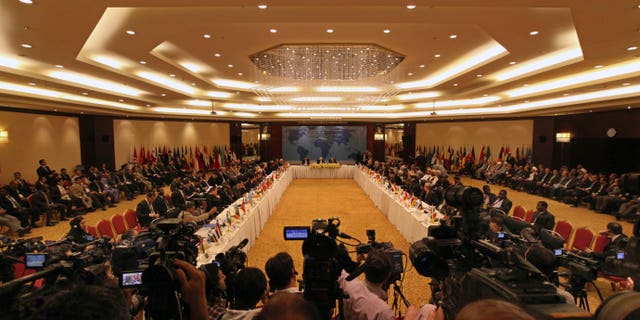 A general view of an international conference on Syria called "Political Solution- Regional Stability", at an hotel, in Tehran, Iran Wednesday, May 29, 2013. Iran has expressed its support for an international conference to end the bloodshed in Syria. Iranian Foreign Minister Ali Akbar Salehi says Tehran "supports Geneva talks and U.N. efforts." The U.S. and Russia are leading a joint push to launch Syria peace talks, possibly next month in Geneva, though there is little evidence to suggest that either side in Syria is ready to halt more than two years of violence that has killed more than 70,000 people. (AP Photo/Vahid Salemi)
