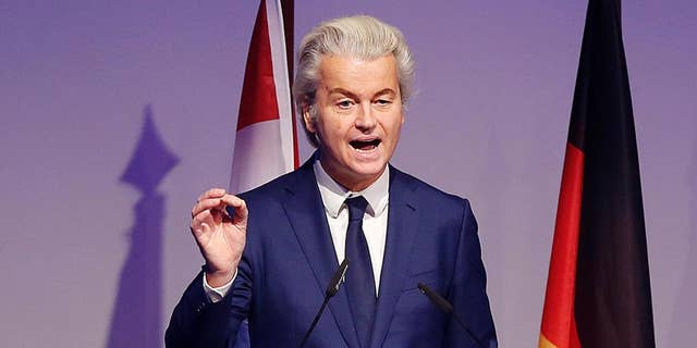 FILE - In this Saturday, Jan. 21, 2017 file photo, Dutch populist anti-Islam lawmaker Geert Wilders delivers a speech at a meeting of European Nationalists in Koblenz, Germany.  Wilders clashed in the Dutch Parliament Tuesday, Jan. 31, 2017 with the Dutch foreign minister over U.S. President Donald Trump's travel ban for people from seven Muslim nations. (AP Photo/ Michael Probst, file)