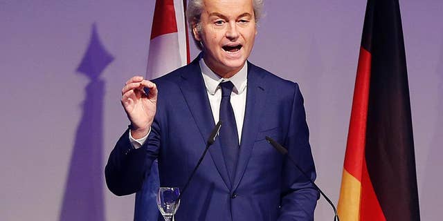 FILE - In this Saturday, Jan. 21, 2017 file photo, Dutch populist anti-Islam lawmaker Geert Wilders delivers a speech at a meeting of European Nationalists in Koblenz, Germany. Wilders clashed in the Dutch Parliament Tuesday, Jan. 31, 2017 with the Dutch foreign minister over U.S. President Donald Trump's travel ban for people from seven Muslim nations. (AP Photo/ Michael Probst, file)