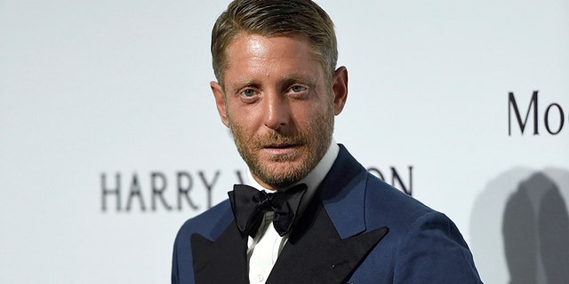 FILE - In this Sept. 26, 2015 file photo, Lapo Elkann arrives for an amfAR charity dinner in Milan, Italy. A criminal charge by the Manhattan district attorney has been dropped against the playboy grandson of the Italian founder of Fiat Automobiles who had been accused of filing a false report when he claimed he was being held against his will in New York City. The 39-year-old was arrested outside a public housing project in December 2016 after his family contacted police, saying he needed $10,000 to guarantee his safety. But authorities say he made up the story after he ran out of money following a two-day binge with an escort. (AP Photo/Giuseppe Aresu, File)