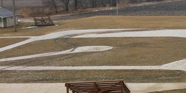 Damage to the "Field of Dreams" movie site in Dyersville, Iowa, is visible after a vandal drove onto the field.