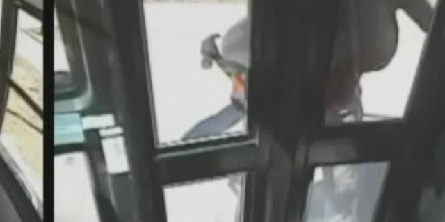 Megan Gumbus, 33, was caught on camera smashing a school bus' window and doors with a hammer.