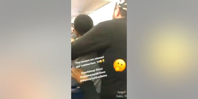 Two male passengers duked it out as fellow travelers chaotically moved out of the way.