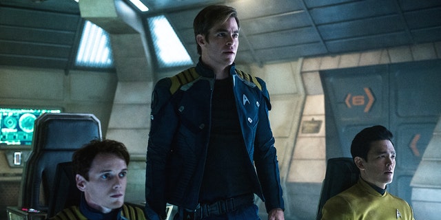 In this image released by Paramount Pictures, from left, Anton Yelchin, Chris Pine and John Cho appear in a scene from, "Star Trek Beyond."