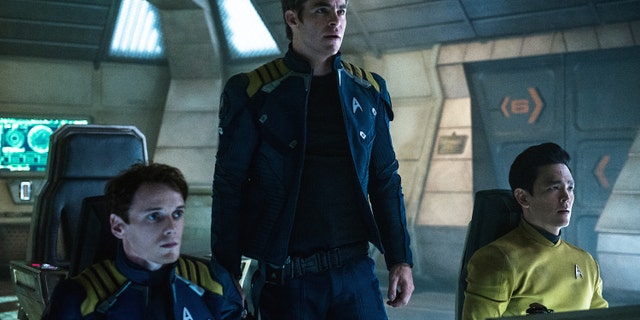 In this image released by Paramount Pictures, from left, Anton Yelchin, Chris Pine and John Cho appear in a scene from, "Star Trek Beyond."