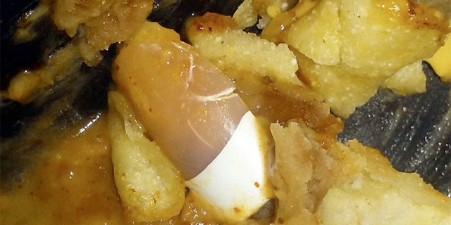 The couple found a full-length fingernail at the bottom of their late night treat.