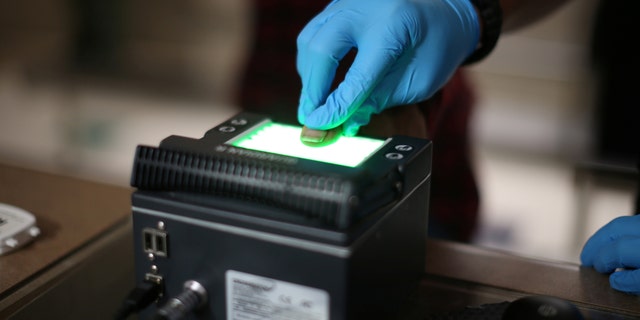 File photo: Mexican national Adalberto Magana-Gonzalez, 44, has his fingerprints taken after being taken into custody by a U.S. Immigration and Customs Enforcement's (ICE) Fugitive Operations team in Santa Ana, California, U.S., May 11, 2017. (REUTERS/Lucy Nicholson)