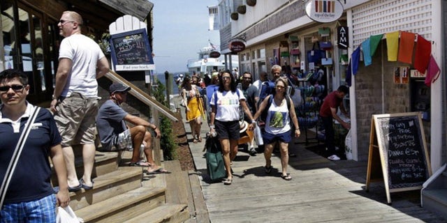 People get off the ferry in Cherry Grove, a beachfront community in New York popular with the LGBT crowd.
