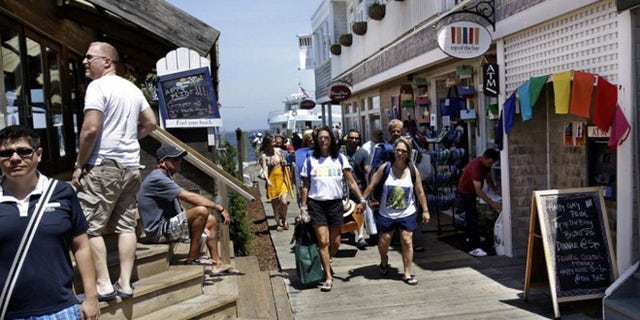 People get off the ferry in Cherry Grove, a beachfront community in New York popular with the LGBT crowd.