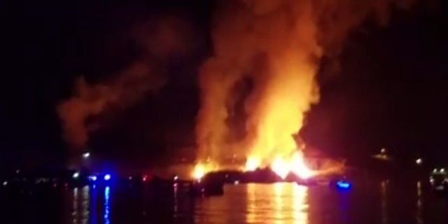 A fire broke out underneath an Independence Day fireworks show in Arizona Monday and was captured on camera.