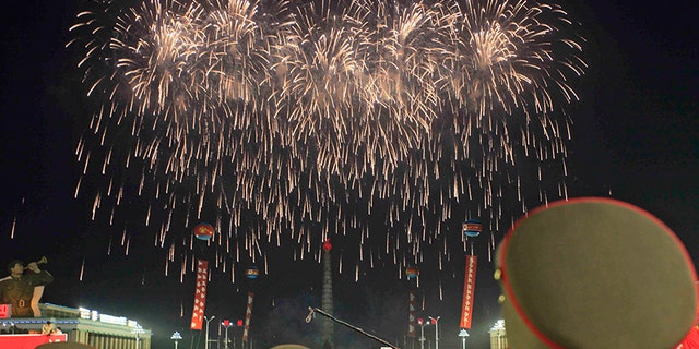 Soldiers watch fireworks in Kim Il Sung Square in Pyongyang, North Korea Thursday to celebrate the test launch of North Korea's first intercontinental ballistic missile two days earlier.