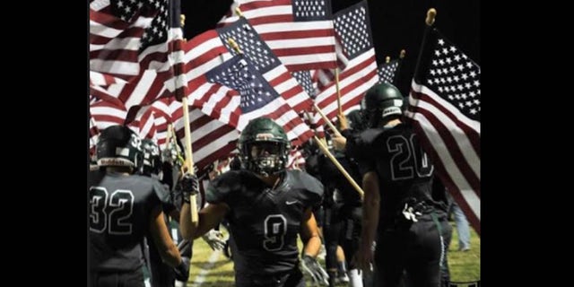 Burroughs High School's football team takes the field on Oct. 20