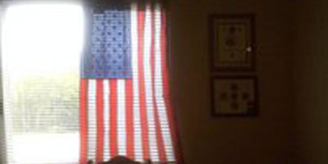 Charlie Price, 28, of Oshkosh, Wis., and officials at Midwest Realty Management have come to a "mutual agreement" that allows the veteran to continue displaying the patriotic symbol
