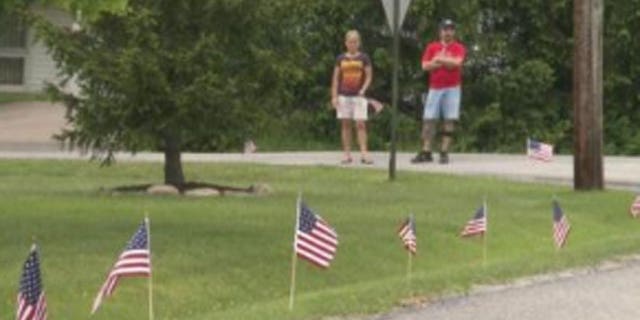 Flags line the streets of Chesterland, Ohio, in honor of fallen soldier Chief Warrant Officer Christopher Thibodeau.
