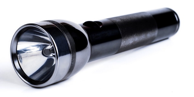 stainless 2 cell flashlight on white