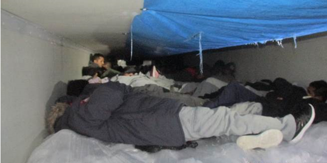 Sixty illegal immigrants were discovered Saturday in a cold tractor carrying vegetables.