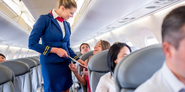 Flight attendants have to try to remain cheerful when dealing with customers, even when times get very tough.