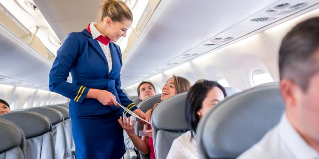 Flight attendants have to try to remain cheerful when dealing with customers, even when times get very tough.