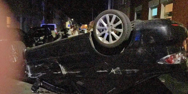 The scene of the crash.The scene of the crash. See SWNS story SWCRASH; ; A drink-driver has been jailed after he crashed and flipped his car - on the day he bought it. Ionut Condurache, 25, had downed seven beers and was three times over the alcohol limit when he got behind the wheel of his new black Mazda 6. The Romanian car wash worker did not have insurance and was disqualified from driving when he crashed into two parked cars in Cheltenham, Glos., last December. He fled the scene but was later spotted walking in the street and breathalysed. Prosecutor May Li told magistrates in Cheltenham, Glos: "He couldn't remember or explain how the crash happened.