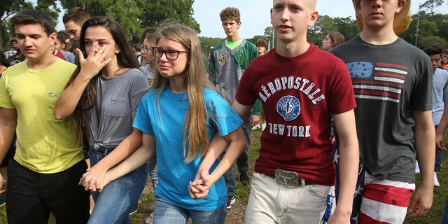 Authorities praised a school resource officer's actions following a shooting at a Florida high school.